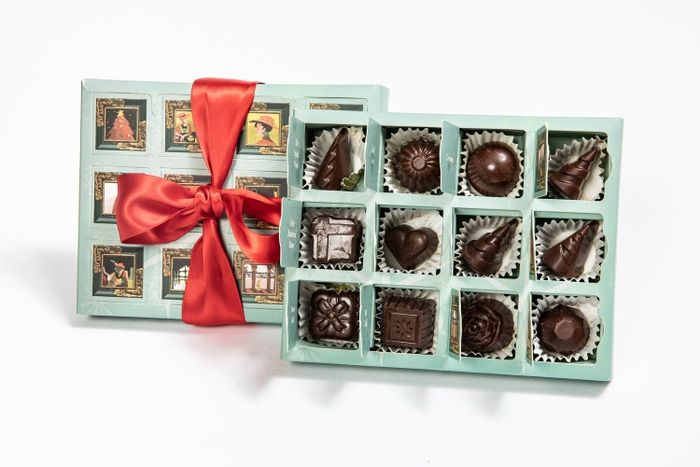 A beautifully packaged advent calendar-style box containing 12 different chocolates.