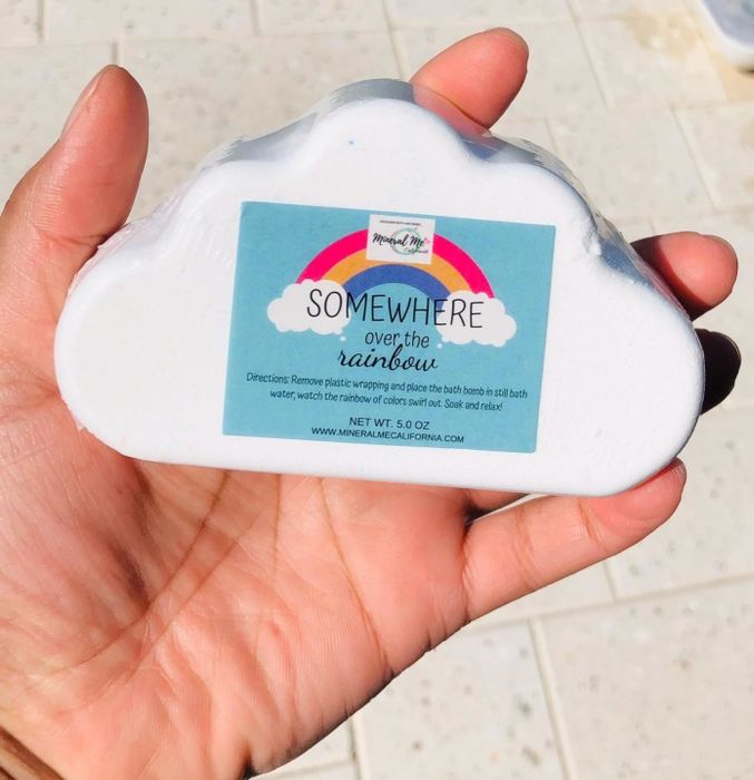 A bath bomb shaped like a cloud, ready to deliver a dreamy and colorful experience.