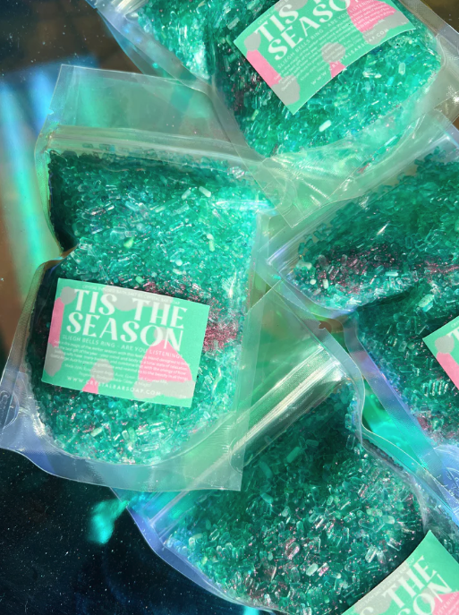 A bag of green crystal-infused bath salts.