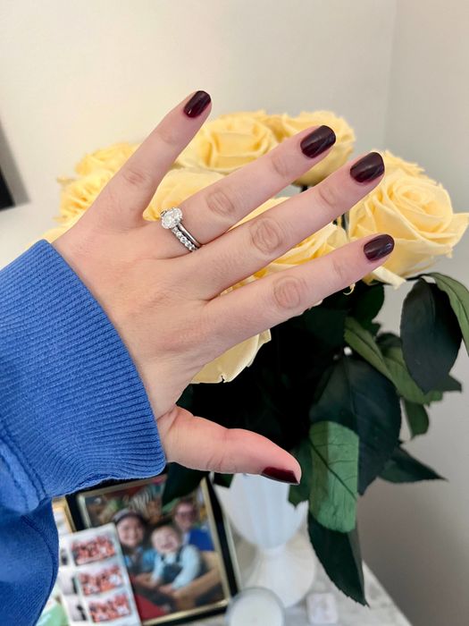 An editor showing off dark brown nails.