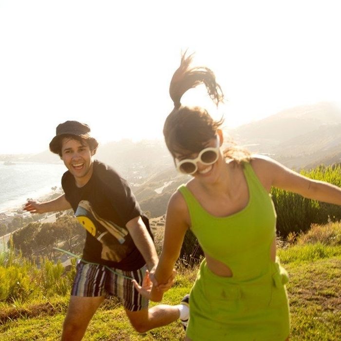 David Dobrik and Charlotte Briar D’Alessio running and smiling together.