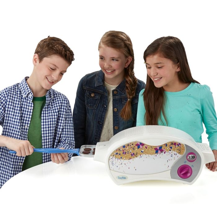 The Easy-Bake ultimate oven in white, with cookies baking inside