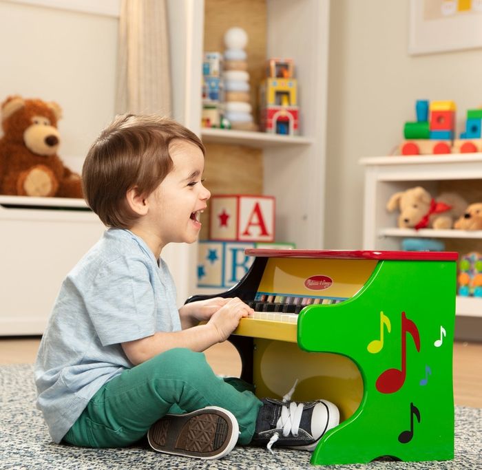 The colorful learn-to-play piano in shades of green, yellow, and red