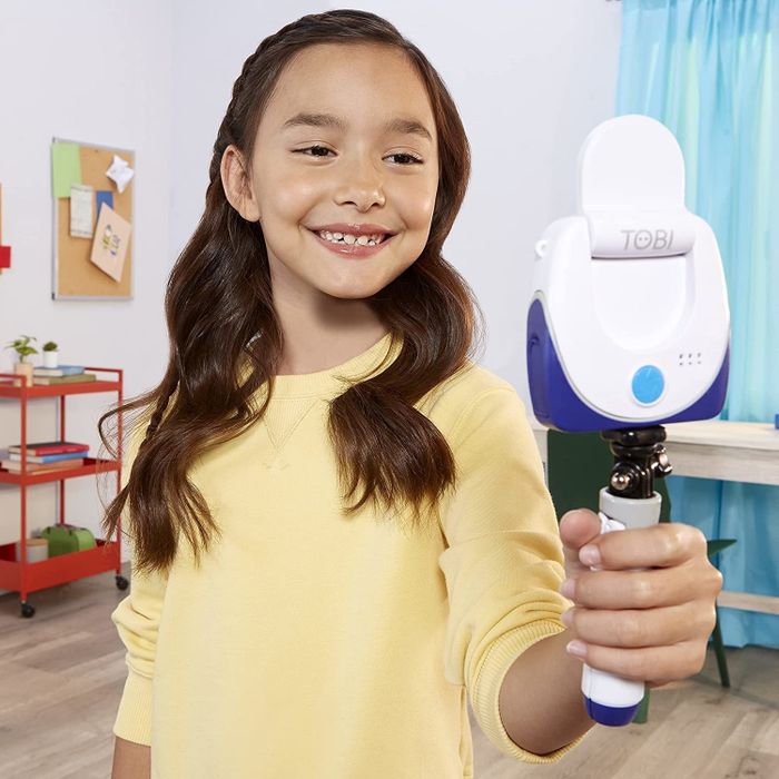 a child capturing a selfie while holding the camera