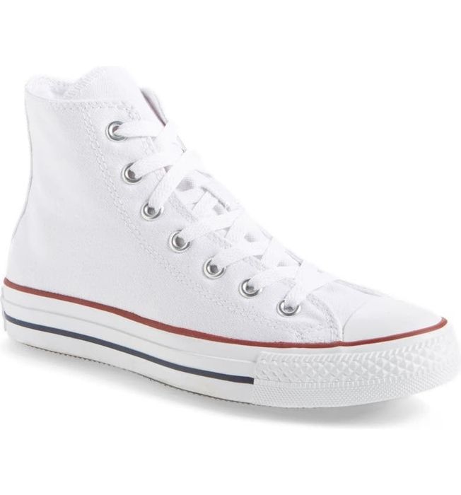 A pair of white Converse sneakers, ready to step up your style game.