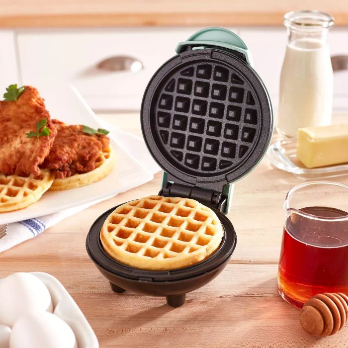 A mini waffle maker that whips up a delicious waffle, perfect for a late breakfast.