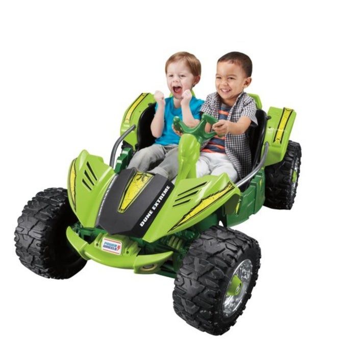 The green battery-powered dune racer in action