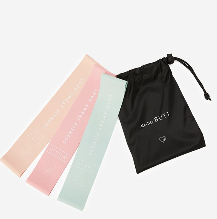 Resistance bands in peach, pink, and mint green hues.