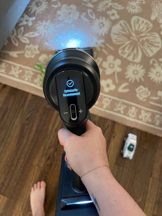 The Samsung AI vacuum with its screen displaying