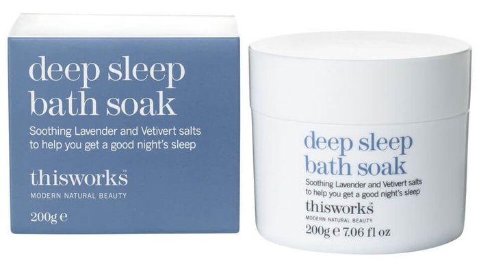 A blue box labeled 'Deep Sleep Bath Soak' next to a white container of the soothing bath soak, ready to help you unwind.