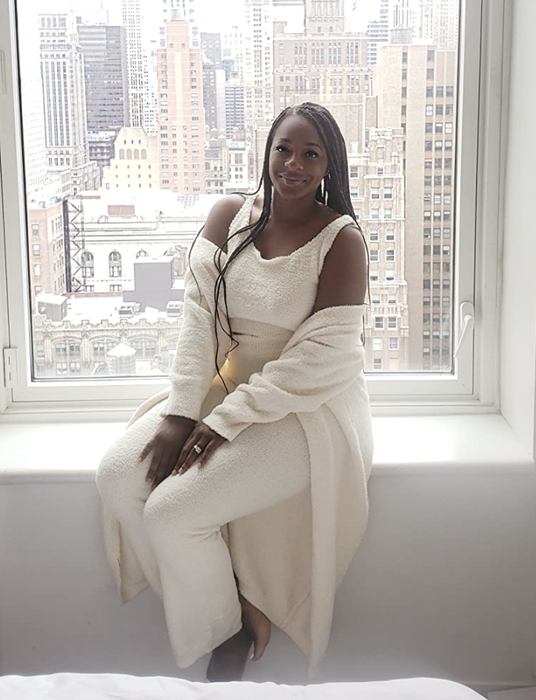 A customer review photo showing them wearing the loungewear set in white.