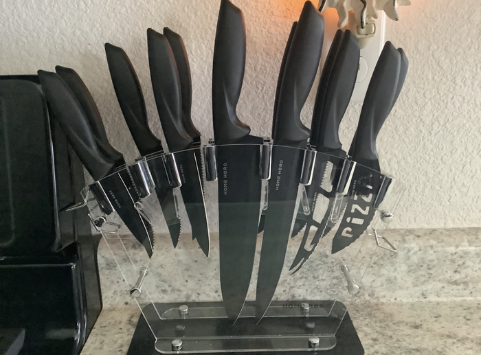 Knives displayed in an acrylic holder.
