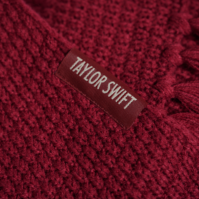 A close-up of the Taylor Swift detail on the scarf.