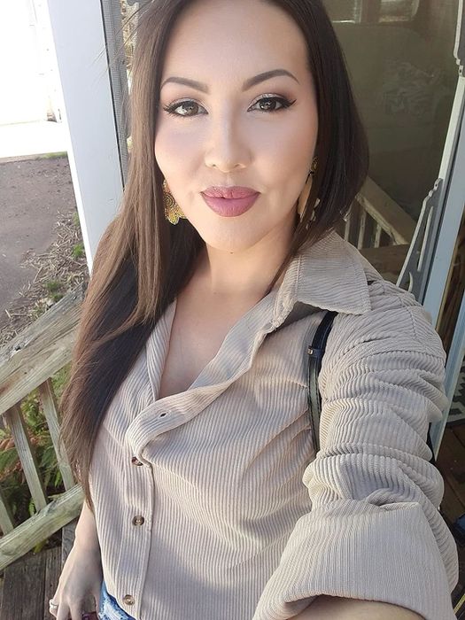 A reviewer wearing a tan corduroy button-down shirt.