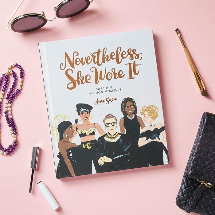 The cover of a book showcasing famous women in elegant black dresses.
