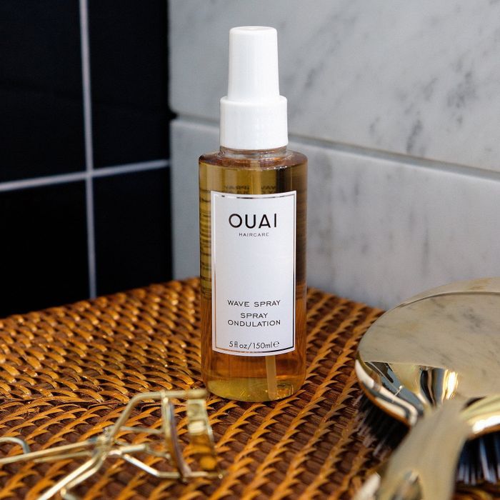 A bottle of Ouai Wave Spray.