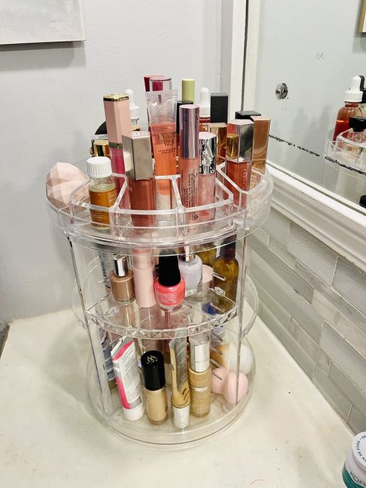 A photo of the makeup organizer displayed on the reviewer's vanity, showcasing its practical and stylish features.