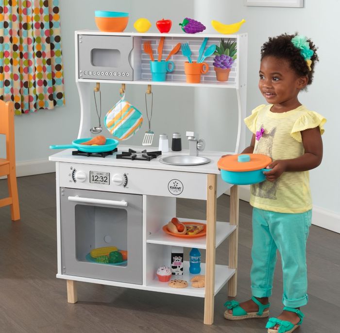 The 38-piece kitchen accessory playset featuring a white stove and counter setup