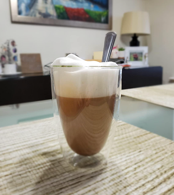 An espresso shot crowned with a layer of foamy milk.