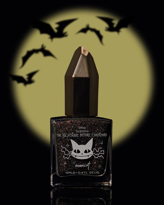 a chic bottle of black glitter nail polish