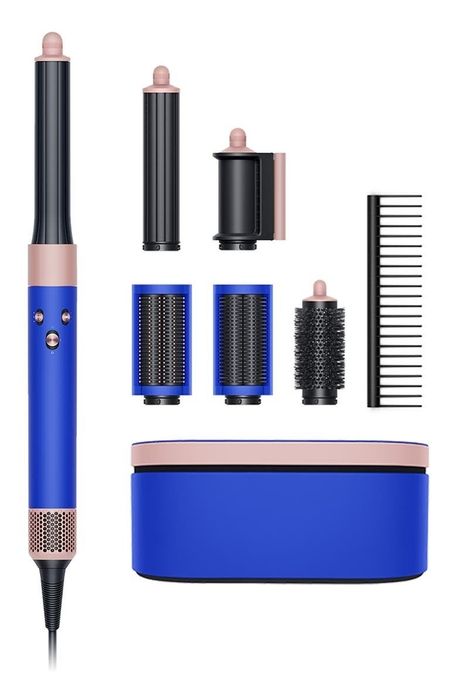 The Dyson Airwrap is a highly praised styling tool that's become a favorite for many. It comes with multiple attachments including two barrel sizes for curls, smoothing brushes, a volumizing round brush, a pre-styling dryer, a base, a nonslip mat, and a storage case. The device uses heat control to prevent damage, and according to Abby Kass, an editor at Mytour, it delivers beautiful, styled hair quickly. She mentions that it only took her 35 minutes to create curls, something that would normally take over an hour with a standard dryer and curling iron. Despite the investment, Abby has been using her Airwrap for over two years and continues to love it. Get it at Nordstrom for $599.99.