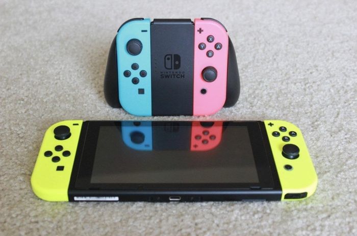 A Nintendo Switch featuring neon yellow Joy-Con controllers
