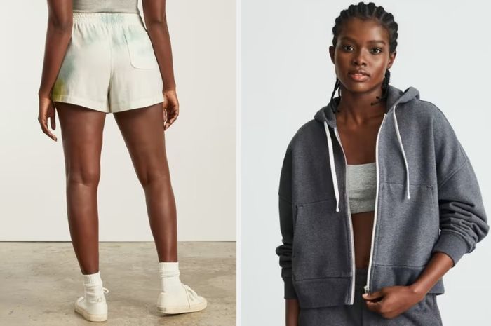 A model flaunts blue, yellow, and cream tie-dye sweat shorts with white sneakers in front of a white wall, while another model pairs a zip-up dark gray hoodie with a matching crop top and sweatpants on a white background.