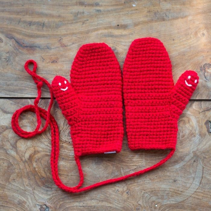 Red mittens attached by a mitten string