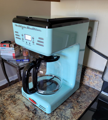 Aqua-colored retro-style coffee maker with a clear pot.