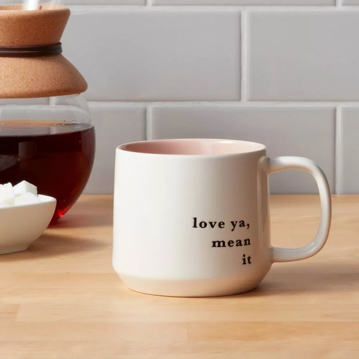 A ceramic mug with the text