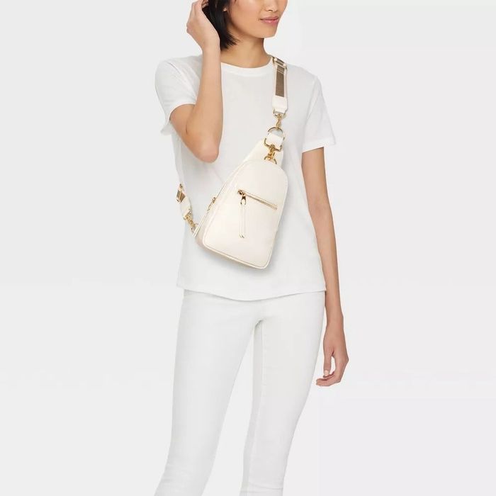 A model confidently wearing the stylish sling bag.