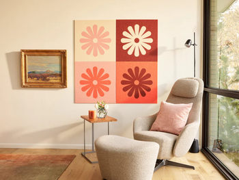 A modern living room with minimalist furniture and vibrant abstract floral wall art