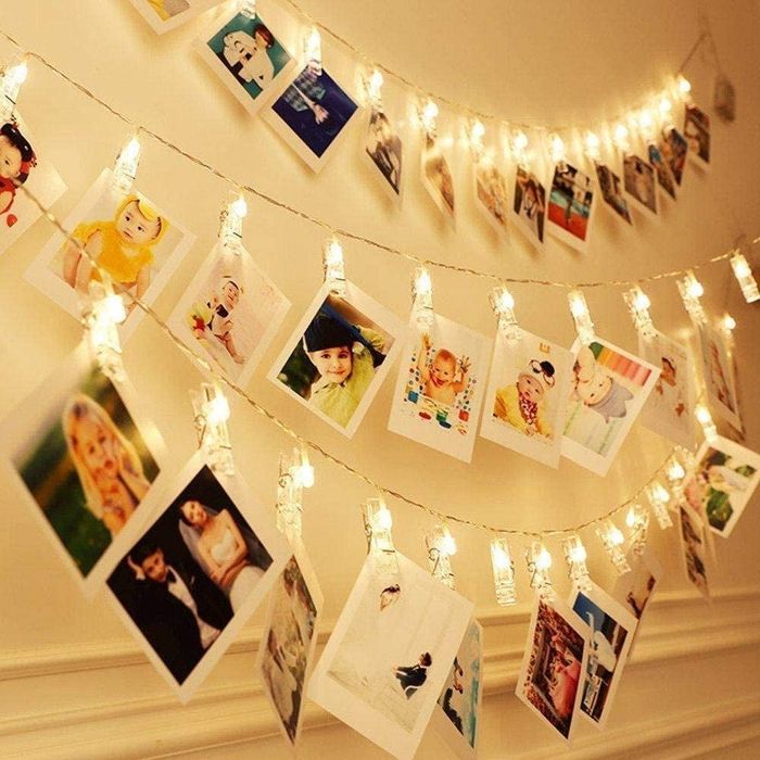 String lights with polaroid photos clipped on, capturing your memories