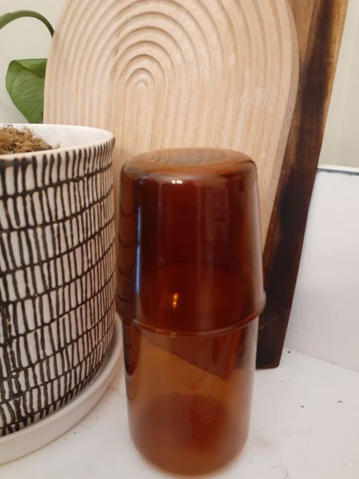 The reviewer's glass placed neatly atop the carafe