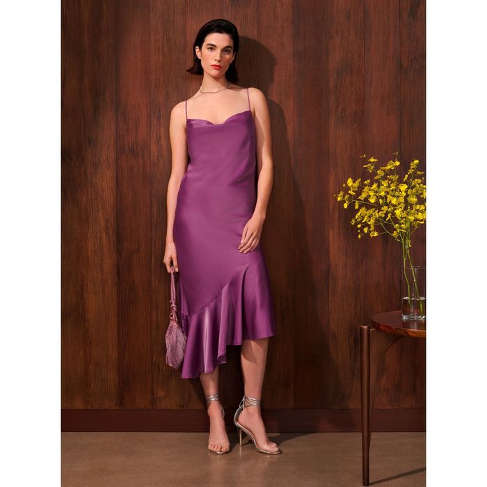 a model wearing the dress in purple