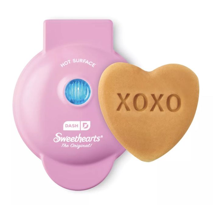 Heart-shaped mini waffle maker featuring the word 