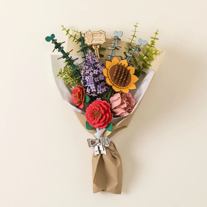 The completed bouquet wrapped in rustic brown paper, ready to be gifted.