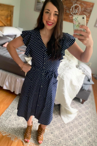 A reviewer wearing the navy tie-waist dress.