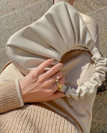 Another Mytourer holding the ivory bag