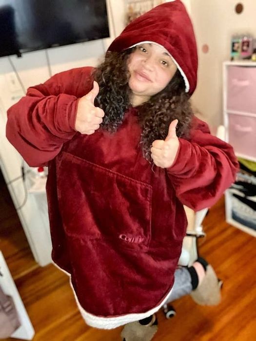 Mytour editor Kayla Boyd in a red version of The Comfy