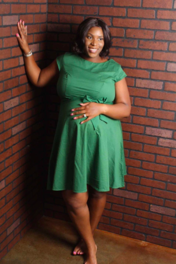 A reviewer rocking the knee-length, short-sleeve, A-line dress in green.