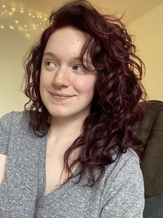 Reviewer showcasing their healthy, wavy hair