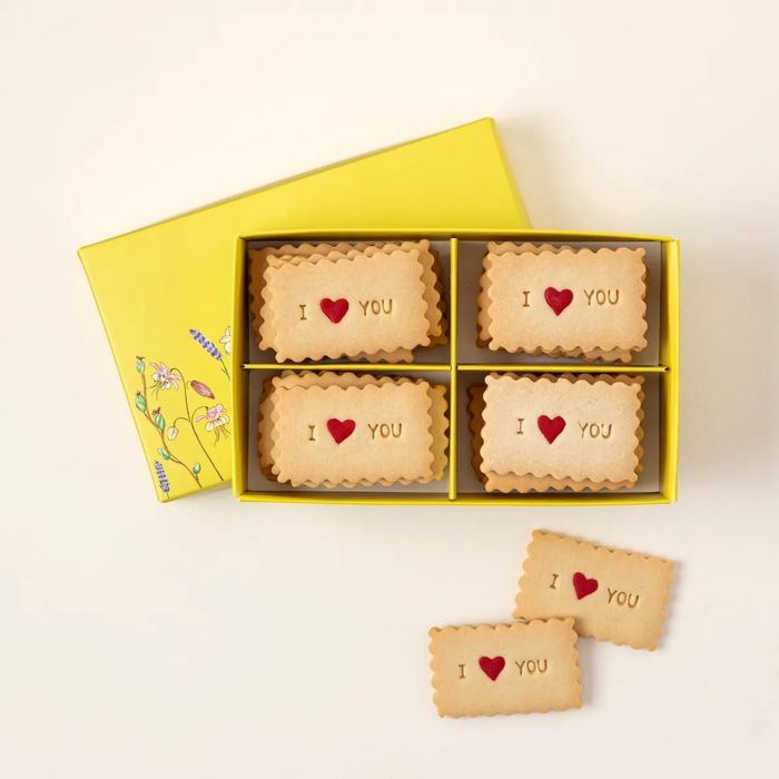 A box containing six cookies, each with