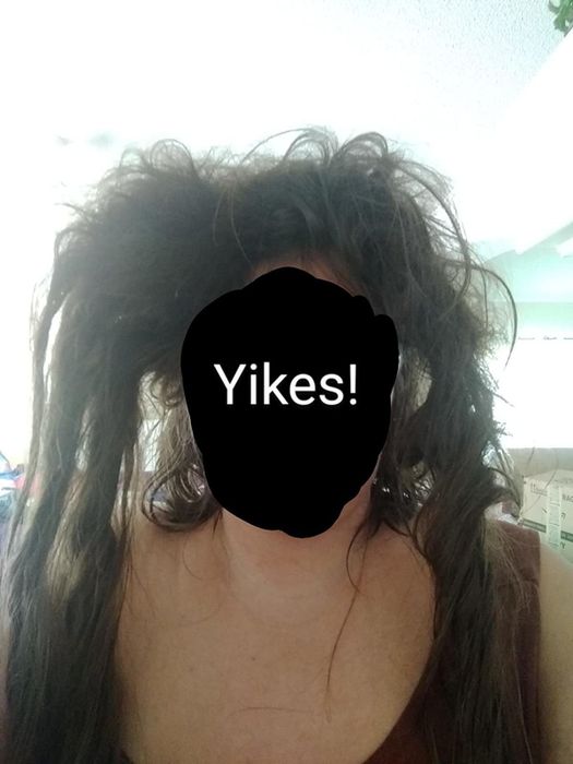 reviewer with highly tangled hair and the word