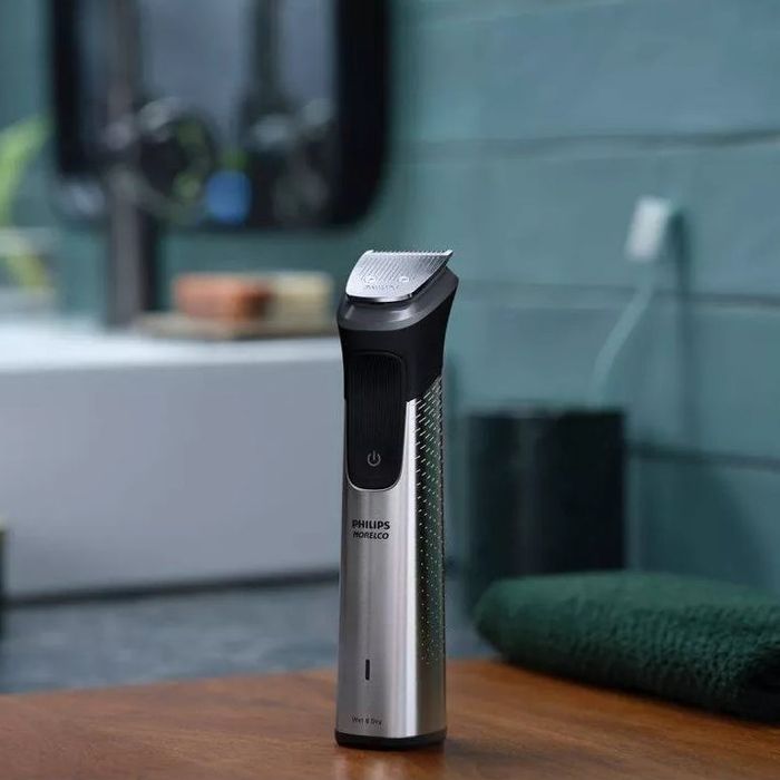 On a bathroom counter, this electric trimmer shows off its modern design and functional ease, perfect for those looking to streamline their personal care routine.