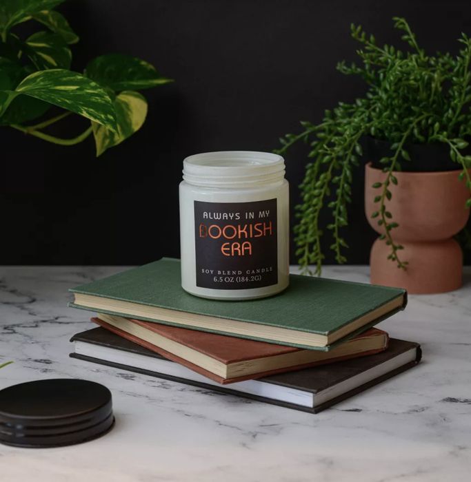 A soy candle labeled 