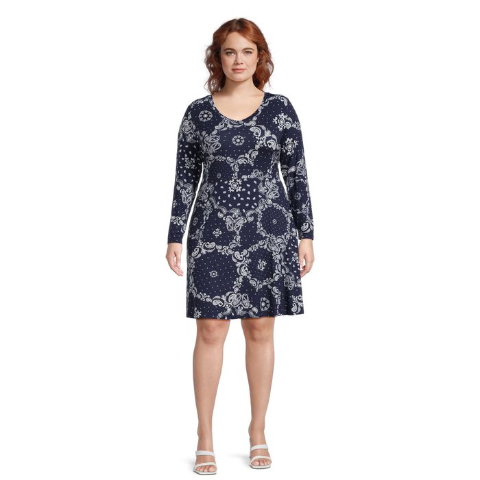 a model wearing the navy and white paisley dress