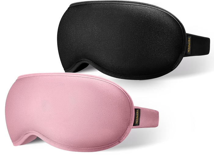 Two sleep masks, one black and one pink, shown from the side with a simple design and branding tag, perfect for a shopping article.