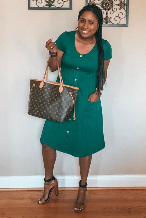 Reviewer showcasing the dress in green, paired with heels