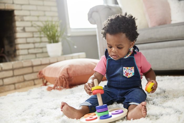 A child engaging with a developmental toy.